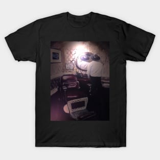 "Reversing the reflection of the Barber; moments before a haircut." T-Shirt